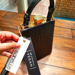 Isabelle NWT vegan crossbody/sachel blackwith handle and adjustable strap.